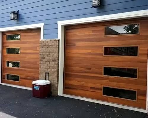 Contemporary cedar-clad garage doors with narrow window bands